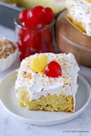 Easy Piña Colada Poke Cake - Love and Confections